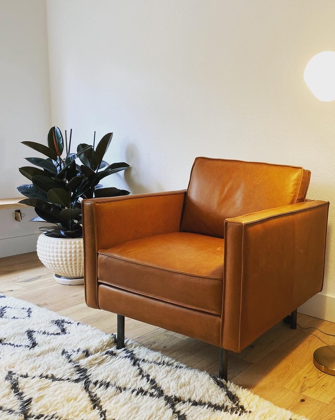 Brown leather armchair and floor lamp in Andrew Flynn's Playa del Rey therapy office.